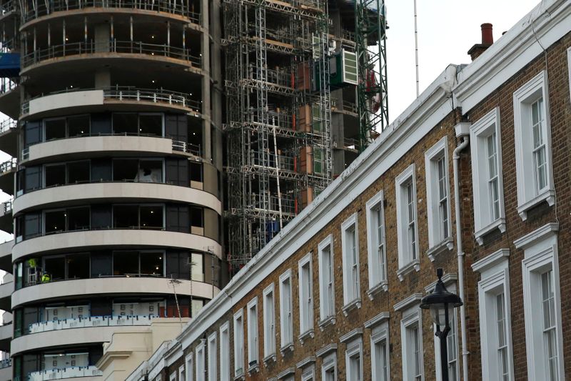&copy; Reuters. An apartment block is constructed behind a row of traditional properties in central London