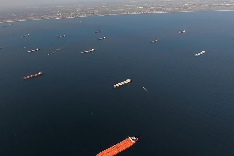 &copy; Reuters. Some of the 27 oil tankers anchored viewed by helicopter off shore from Long Beach