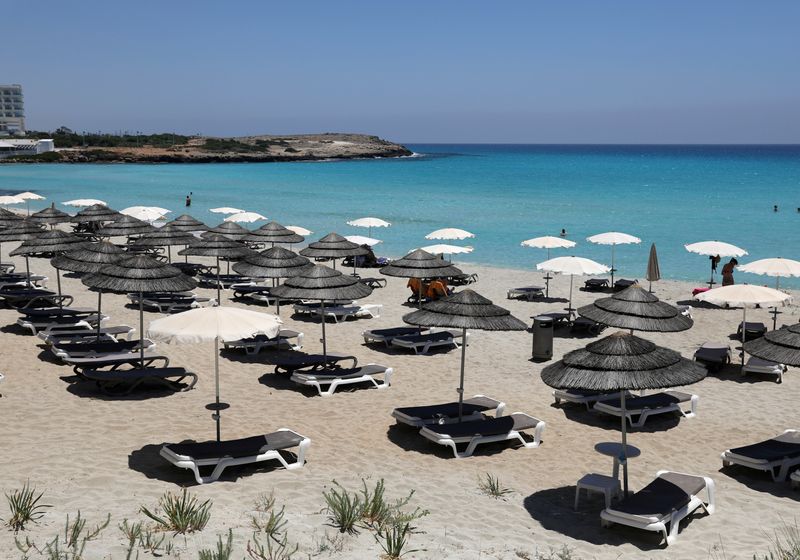 &copy; Reuters. Empty sunbeds are seen at Nissi Beach in the resort of Ayia Napa