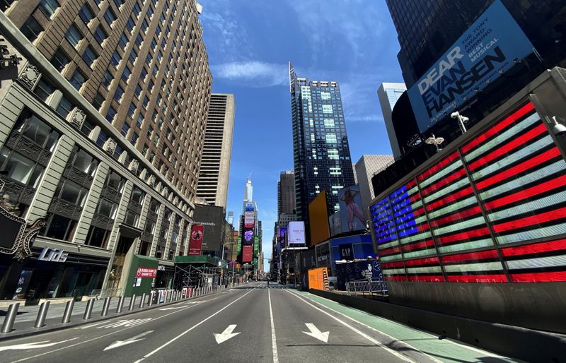 © Reuters. A nearly deserted 7th Avenue in Times Square is seen near midday during outbreak of the coronavirus disease (COVID-19) in New York