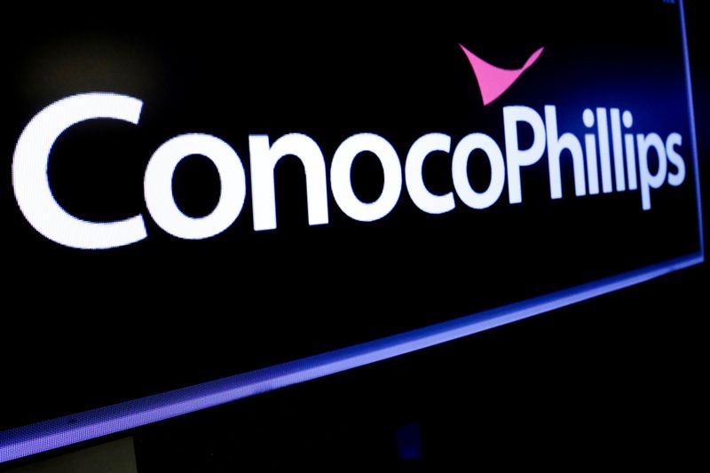 &copy; Reuters. The logo for ConocoPhillips is displayed on a screen on the floor at the NYSE in New York