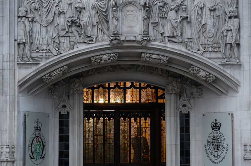 © Reuters. A member of security stands guard inside the Supreme Court in London