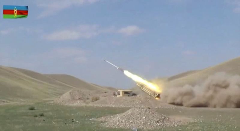 © Reuters. A still image shows an Azeri multiple rocket launcher performing strikes during clashes over the breakaway region of Nagorno-Karabakh