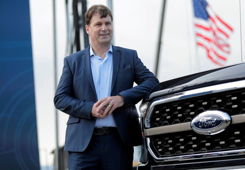 &copy; Reuters. FILE PHOTO: Ford Motor Co. CEO Jim Farley poses next to a new 2021 Ford F-150 pickup truck at the Rouge Complex in Dearborn,Michigan