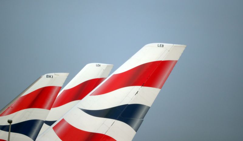 © Reuters. FILE PHOTO: FILE PHOTO: British Airways logos are seen on tail fins at Heathrow Airport in west London