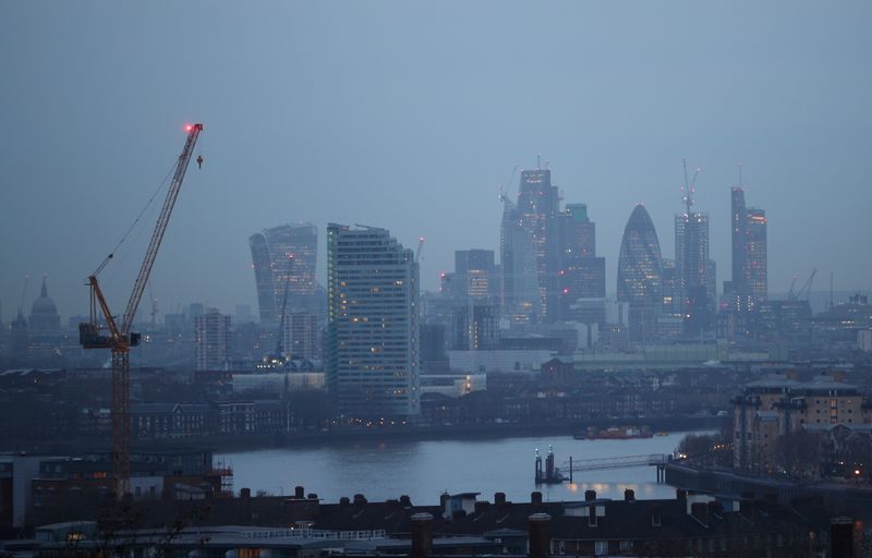 &copy; Reuters. FILE PHOTO: The City of London financial district is seen during early morning mist from Greenwich Park in London