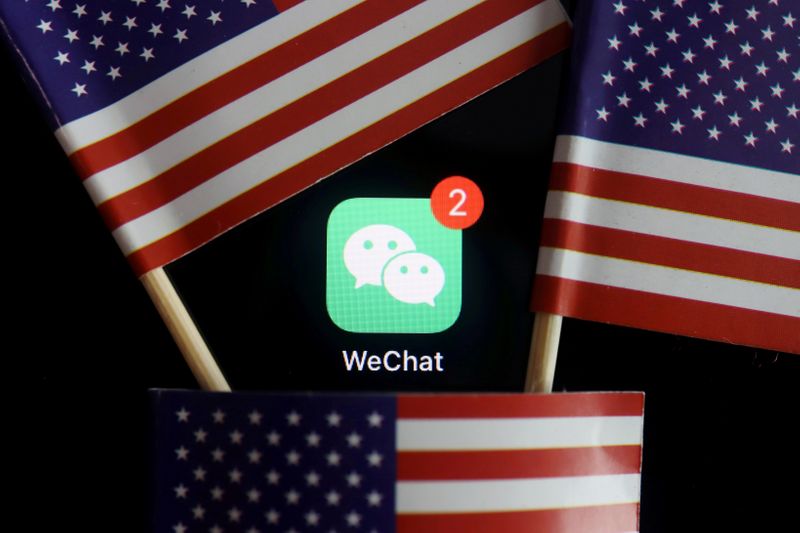 &copy; Reuters. FILE PHOTO: The messenger app WeChat is seen among U.S. flags in this illustration picture