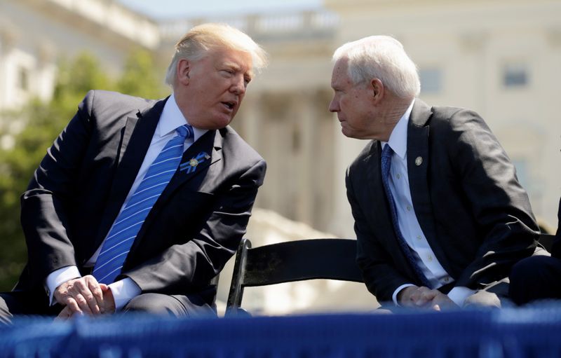 © Reuters. FILE PHOTO: President Donald Trump speaks with Attorney General Jeff Sessions as they attend the National Peace Officers Memorial Service on the West Lawn of the U.S. Capitol in Washington