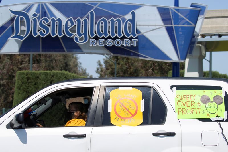 &copy; Reuters. FILE PHOTO: Disney cast members stage a car caravan outside Disneyland California, calling for higher safety standards for Disneyland to reopen