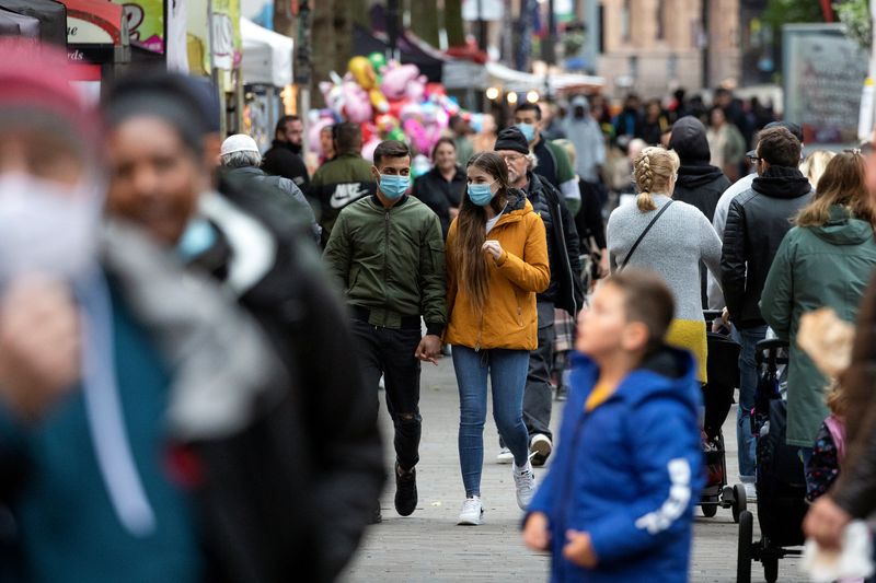 &copy; Reuters. Pedestrians walk on the High Street in Croydon, south London