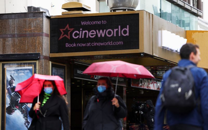 © Reuters. People walk past a Cineworld in Leicester's Square in London