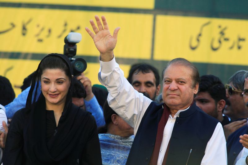 &copy; Reuters. Nawaz Sharif, former Prime Minister and leader of Pakistan Muslim League, gestures to supporters as his daughter Maryam Nawaz looks on during party&apos;s workers convention in Islamabad
