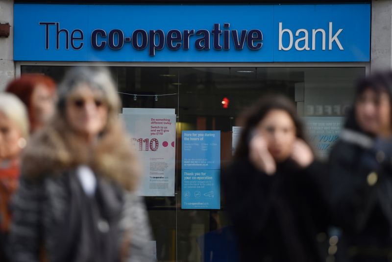 &copy; Reuters. People walk past a branch of The Co-operative Bank in London