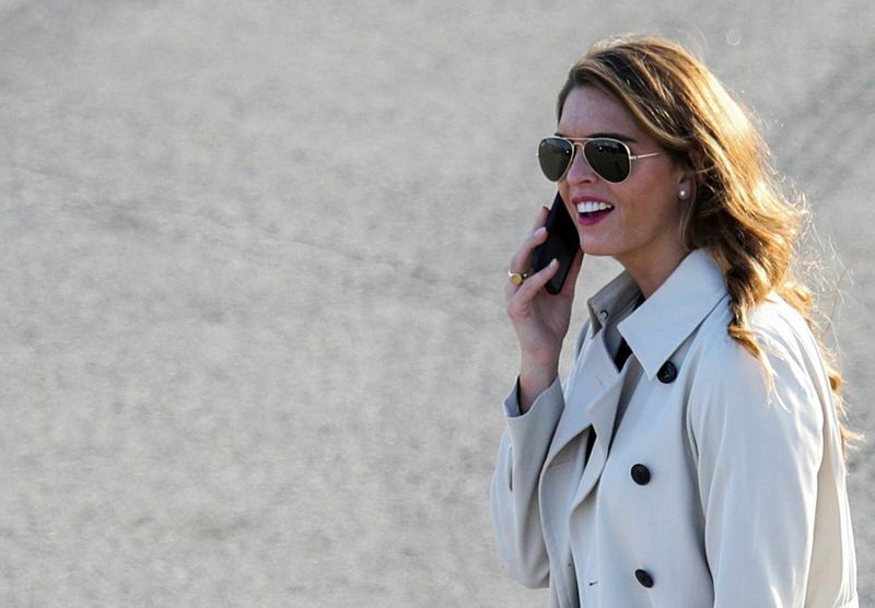 © Reuters. FILE PHOTO: White House counselor to the president Hope Hicks uses her smartphone at a campaign event for U.S. President Donald Trump at Dayton International Airport in Dayton