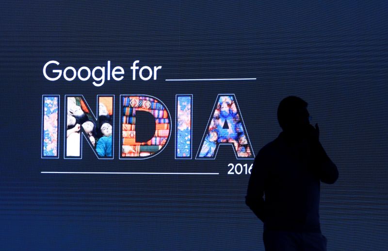 &copy; Reuters. FILE PHOTO: Man stands in front of a screen during a Google event in New Delhi