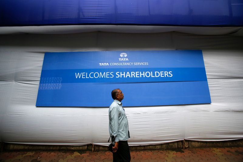 &copy; Reuters. A shareholder arrives for the TCS annual general meeting in Mumbai