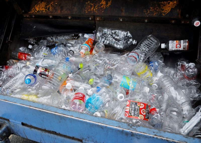 &copy; Reuters. FILE PHOTO: Collected plastic bottles or PET bottles are seen inside a garbage truck during a recyclable waste collection service in Tokyo