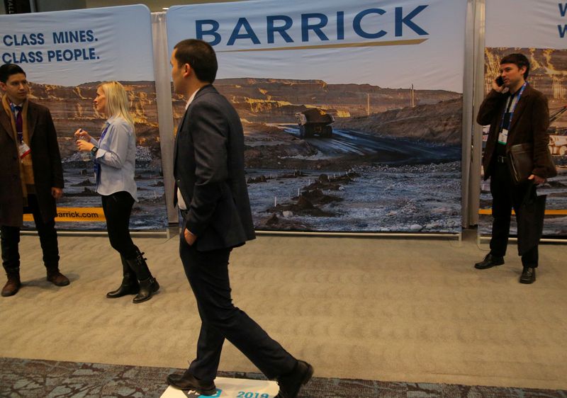 &copy; Reuters. FILE PHOTO: A visitor passes a Barrick Gold mining company display during the PDAC convention in Toronto