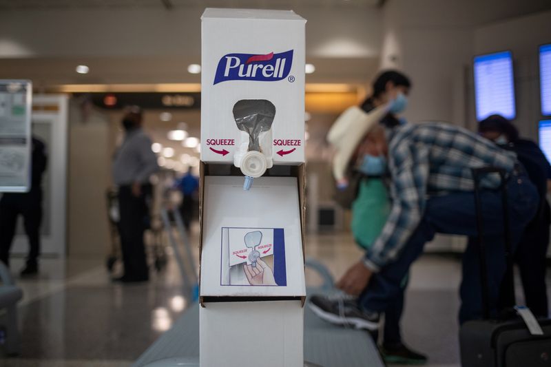 &copy; Reuters. FILE PHOTO: Hand sanitizing station is seen after passengers pass a security check at IAH George Bush Intercontinental Airport in Houston