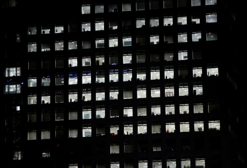 &copy; Reuters. FILE PHOTO: Office lighting is seen through windows of a high-rise office building in Tokyo