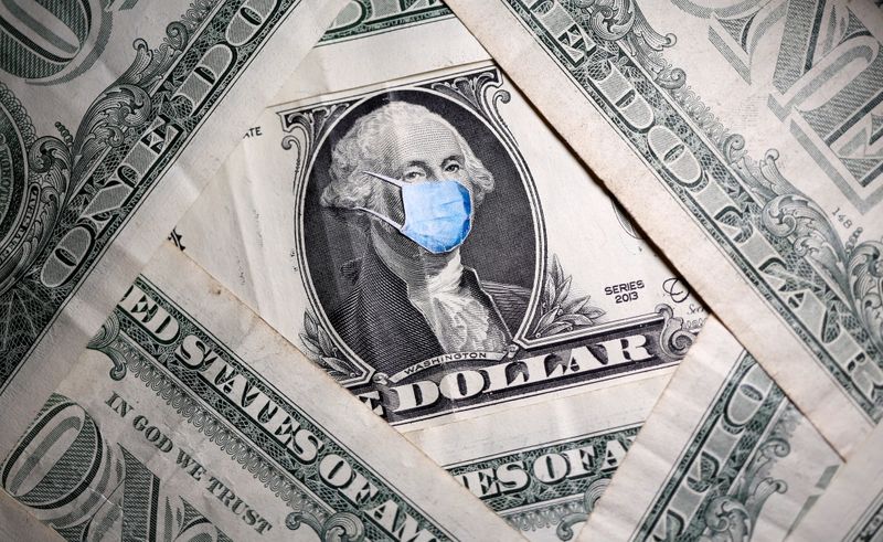 &copy; Reuters. George Washington is seen with printed medical mask on the one dollar banknote in this illustration taken