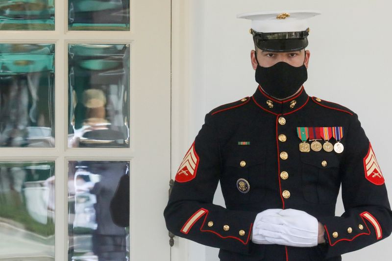 © Reuters. A U.S. Marine is posted at the West Wing door, an indication that Trump is in the Oval Office at the White House in Washington