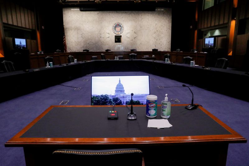 © Reuters. FILE PHOTO: The witness table sits ready for Supreme Court nominee Judge Amy Coney Barrett to begin her confirmation hearings in the U.S. Senate Judiciary Committee hearing room on Capitol Hill in Washington