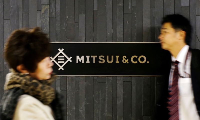 &copy; Reuters. FILE PHOTO: People walk past the logo of Japanese trading company Mitsui &amp; Co in Tokyo