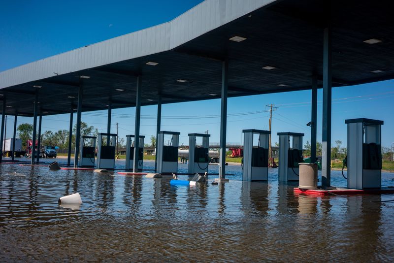 &copy; Reuters. FILE PHOTO: A gas station remains flooded from Hurricane Delta in Lake Charles