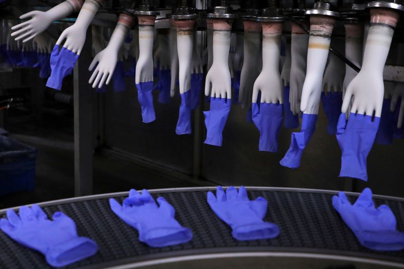 &copy; Reuters. FILE PHOTO: Newly-made gloves are pictured inside Top Glove factory in Shah Alam