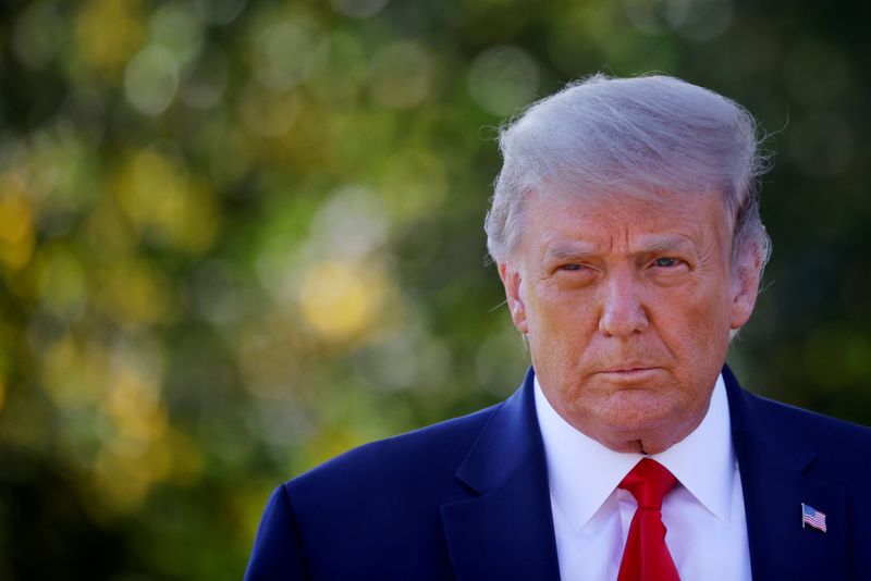 &copy; Reuters. FILE PHOTO: U.S. President Donald Trump approaches reporters as he departs on campaign travel to Minnesota from the South Lawn at the White House in Washington, U.S.