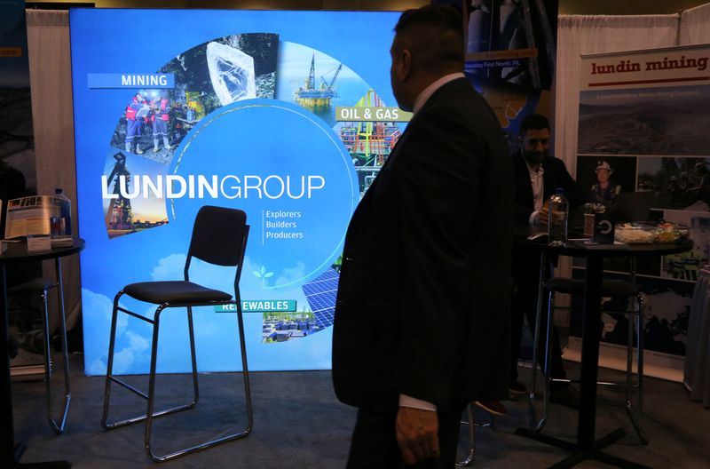 &copy; Reuters. A man passes the Lundin Group mining company booth during the PDAC convention in Toronto