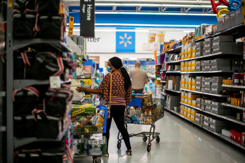 &copy; Reuters. FILE PHOTO: A shopper is seen wearing a mask while shopping at a Walmart store, in North Brunswick, New Jersey