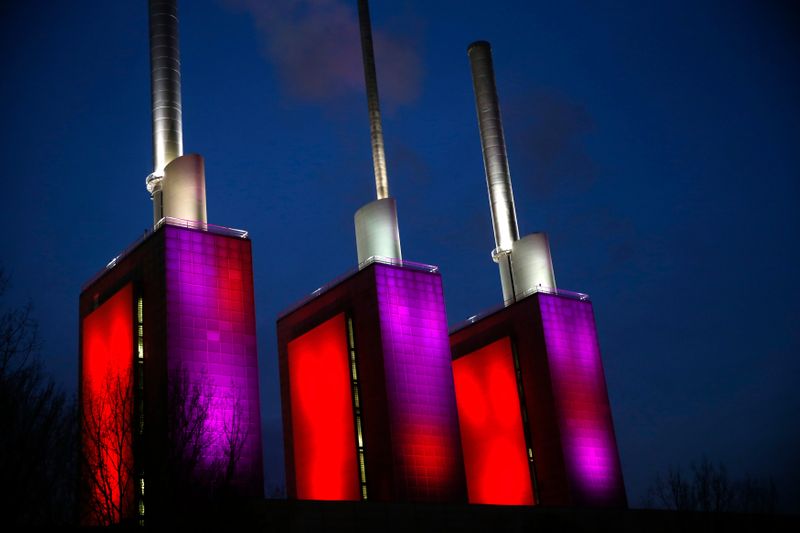 &copy; Reuters. The so-called &quot;three warm brothers&quot; of the combined heat and power plant Linden of Hanover&apos;s public utility company Enercity is illuminated with red and purple lights in Hanover