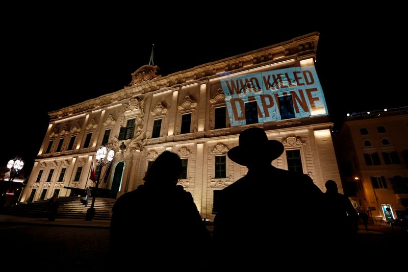 © Reuters. FILE PHOTO: Activists project the words 