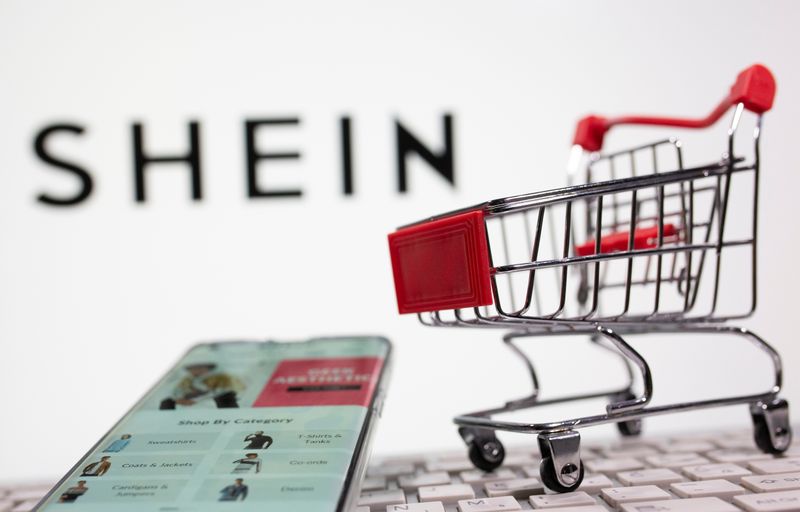 &copy; Reuters. A keyboard and a shopping cart are seen in front of a displayed Shein logo in this illustration picture