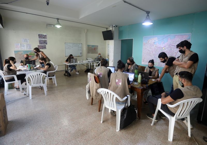 &copy; Reuters. Volunteers work together inside a room at Beit el Baraka, a local NGO, in Beirut