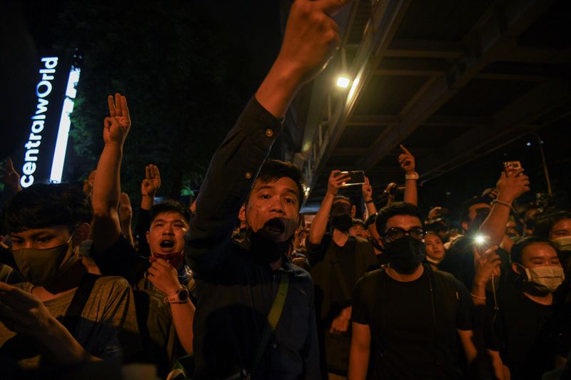 &copy; Reuters. People show the three-finger salute during a gathering of pro-democracy protesters who demand the government to resign and to release detained leaders in Bangkok