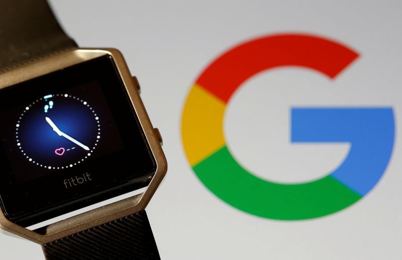 &copy; Reuters. Fitbit Blaze watch is seen in front of a displayed Google logo in this illustration