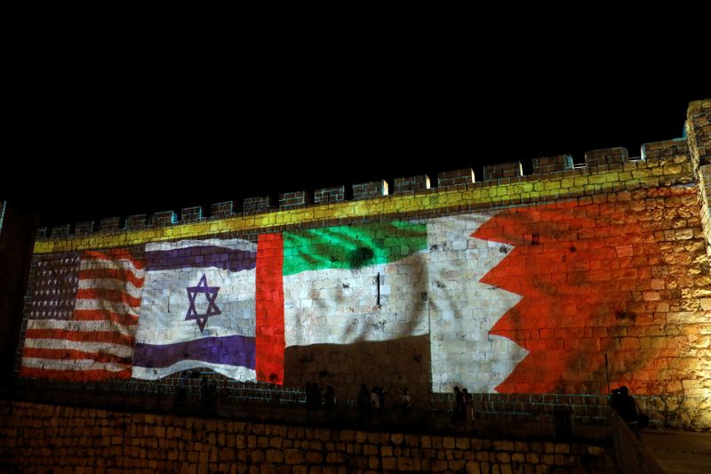 &copy; Reuters. National flags of Bahrain, UAE, Israel and the U.S. are projected on the walls of Jerusalem&apos;s Old city