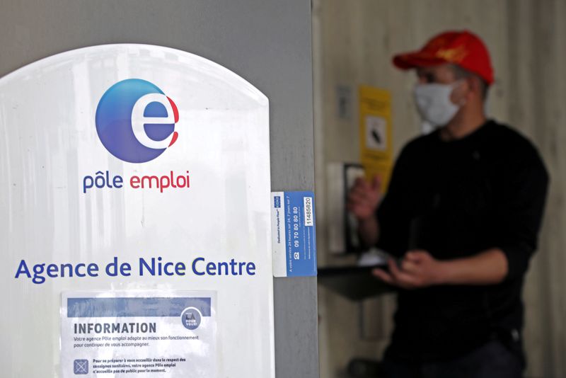 &copy; Reuters. FILE PHOTO: A job seeker, wearing a protective face mask, visits a National Agency for Employment office in Nice