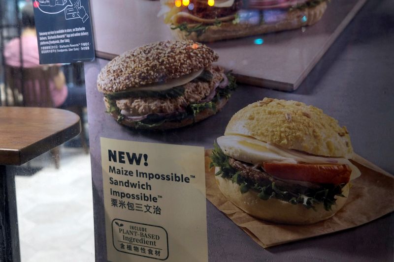 &copy; Reuters. FILE PHOTO: A poster showing product from plant-based burger maker Impossible foods been using at Starbucks, in Hong Kong