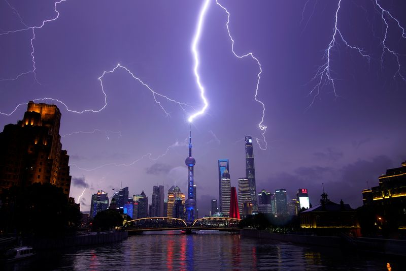 &copy; Reuters. Lightning strikes are seen above the skyline of Shanghai&apos;s financial district of Pudong