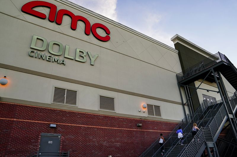 &copy; Reuters. Three women use the emergency exit stairs of an AMC movie theater as a makeshift gym in Smyrna