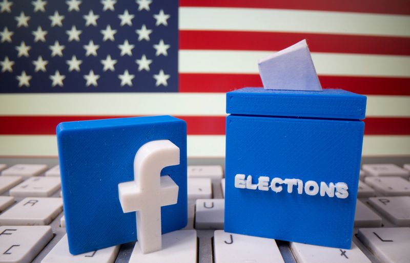 &copy; Reuters. FILE PHOTO: A 3D-printed elections box and Facebook logo are placed on a keyboard in front of U.S. flag in this illustration