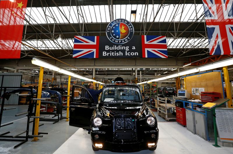 &copy; Reuters. A worker checks a TX4 at the end of the production line at the London Taxi Company in Coventry