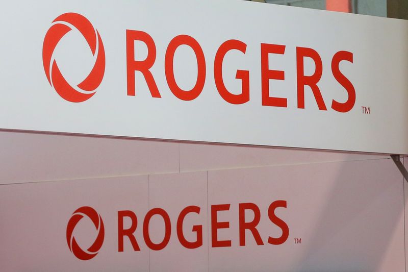 &copy; Reuters. Rogers Communications logos are seen above a booth at the Canadian International AutoShow in Toronto