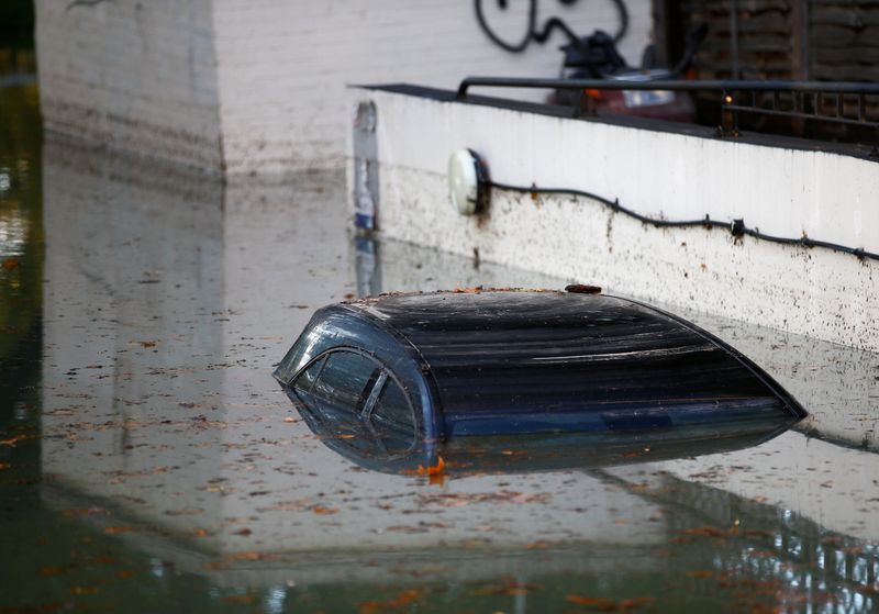 &copy; Reuters. FILE PHOTO: A car is submerged after a water supply pipe burst in the Hackney district of London