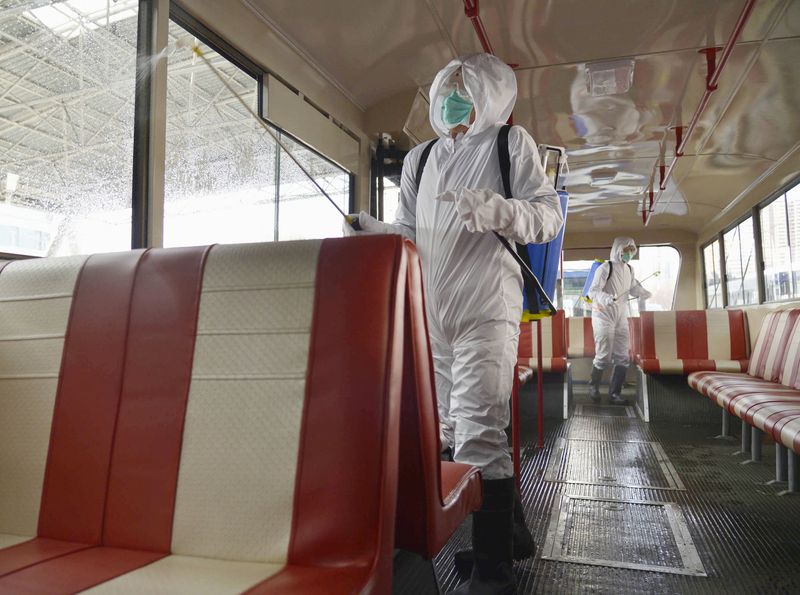 &copy; Reuters. A trolley bus is disinfected amid fears over the spread of the novel coronavirus in Pyongyang