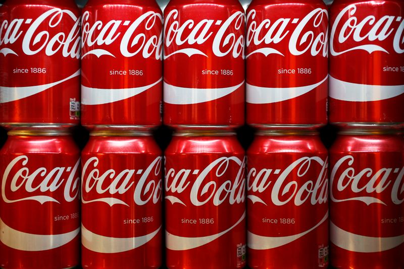 &copy; Reuters. Cans of Coca-Cola sit on a shelf in a store in London